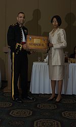 LtCol (Ret) Dawn Harrison receiving a gift from the Chapter